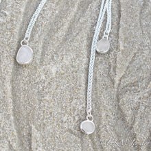 Load image into Gallery viewer, small medium and large raw cape may diamond necklaces in sterling bezels by hkm jewelry laying in sand