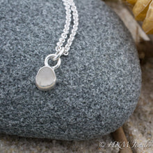 Load image into Gallery viewer, close up front view of small size raw cape may diamond necklace in a sterling silver bezel by hkm jewelry