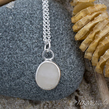 Load image into Gallery viewer, close up front view of large size raw cape may diamond necklace in a sterling silver bezel by hkm jewelry