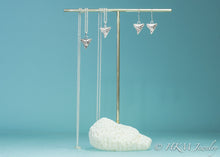 Load image into Gallery viewer, bull shark teeth earrings and matching necklaces cast in silver by hkm jewelry on brass and coral display stand