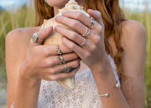 Load image into Gallery viewer, model wearing large size key hole limpet ring by hkm jewelry in oxidized silver finish