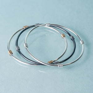 Life saver bangle set by hkm jewelry in silver, and gold