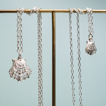 Load image into Gallery viewer, close up of large and small lions paw scallop shell necklace in polished sterling silver with anchor marine chain by hkm jewelry