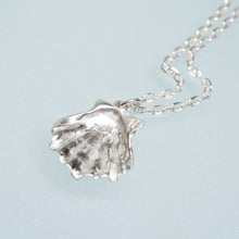 Load image into Gallery viewer, close up underside view of the large lions paw scallop shell necklace in polished sterling silver by hkm jewelry