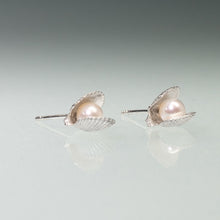 Load image into Gallery viewer, Side View of the Mini scallop shell stud earrings cast in silver with freshwater pearls inside by Hali MacLaren of HKM Jewelry