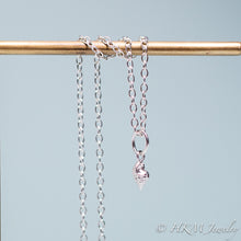 Load image into Gallery viewer, underside of mini conch seashell necklace cast in silver by hali maclaren of hkm jewelry