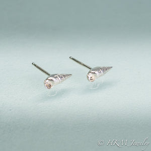mini auger snail seashell stud earrings close up side view in polished sterling silver by hkm jewelry