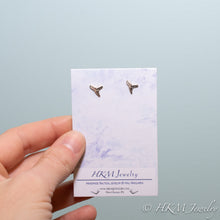 Load image into Gallery viewer, mini lemon shark teeth stud earrings cast in silver on a watercolor earring card by hali maclaren of hkm jewelry