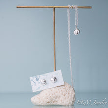 Load image into Gallery viewer, matching seashell set of earrings and necklace by hkm jewelry on brass and coral stand