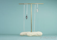 Load image into Gallery viewer, cast three lined mudsnail necklaces in sterling silver by hkm jewelry on a brass and coral jewelry display