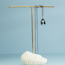 Load image into Gallery viewer, mussel pearl necklace by hkm jewelry on coral and brass jewelry stand