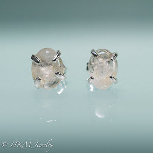 close up of medium size prong set tumble polished cape may diamond stud earrings in sterling by hkm jewelry