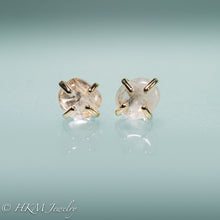 Load image into Gallery viewer, close up front view of medium size prong set tumble polished cape may diamond stud earrings in 14k yellow gold by hkm jewelry