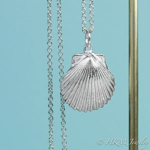 detail close up of Large scallop shell necklace in polished sterling silver by hkm jewelry
