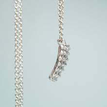 Load image into Gallery viewer, side view of cast silver urchin test shard in recycled silver by hkm jewelry