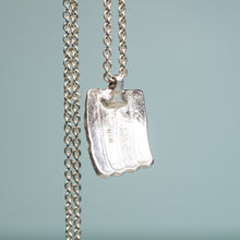 Load image into Gallery viewer, back view of cast silver urchin test shard in recycled silver by hkm jewelry