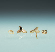 Load image into Gallery viewer, Gold shark tooth earrings on a light blue background
