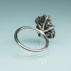 underside back view of northern star coral cast in oxidized recycled silver and prong set in a ring by hkm jewelry