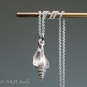 front view of fl fighting conch shell necklace in polished sterling silver by hkm jewelry