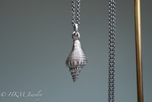 Load image into Gallery viewer, back view of fl fighting conch shell necklace in oxidized sterling silver  by hkm jewelry
