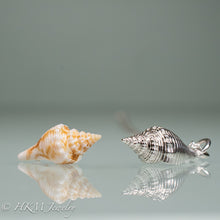 Load image into Gallery viewer, side view of fl fighting conch shell and cast silver replica by hkm jewelry
