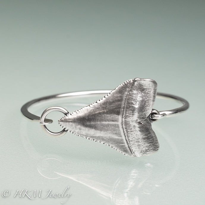 close up of Great White Shark Tooth Cuff by hkm jewelry in oxidized sterling silver
