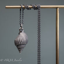 Load image into Gallery viewer, back view of cast silver nutmeg shell necklace in an oxidized finish by hkm jewelry
