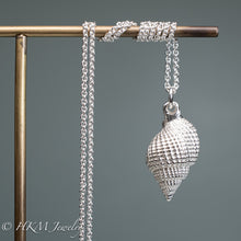 Load image into Gallery viewer, back view of cast silver nutmeg shell necklace in a polished finish by hkm jewelry
