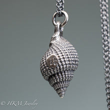 Load image into Gallery viewer, close up view of hallmark 925 and makers mark on cast silver nutmeg shell necklace in an oxidized finish by hkm jewelry
