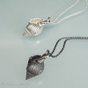 cast silver sanibel nutmeg shell necklaces in polished and oxidized finishes by hkm jewelry 