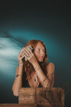 Load image into Gallery viewer, Female, red-head, oyster seed cuff, limpet ring, kitten’s paw ring, viking rope cuff, life saver cuff, oyster seed necklace, green/blue, teal, underwater background
