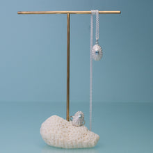 Load image into Gallery viewer, Jewelry set including a necklace, ring, and earrings on a stand with a blue background

