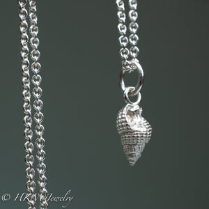 close up of tritia trivittata - Threeline Mud Snail cast in silver by hkm jewelry