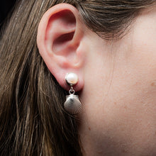 Load image into Gallery viewer, bay scallop and pearl earrings with two tier dangle on model
