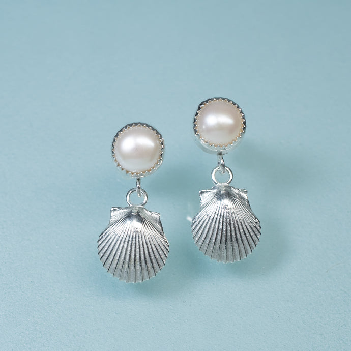 bay scallop and pearl earrings with two tier dangle on blue background