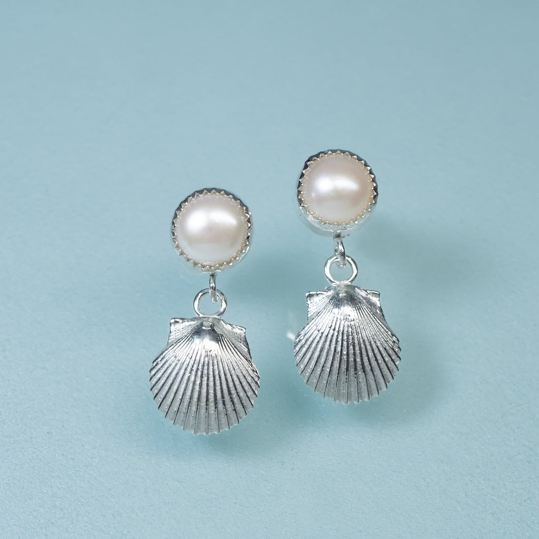 bay scallop and pearl earrings with two tier dangle on blue background