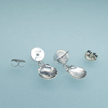 Load image into Gallery viewer, backside of bay scallop and pearl earrings with two tier dangle on blue background
