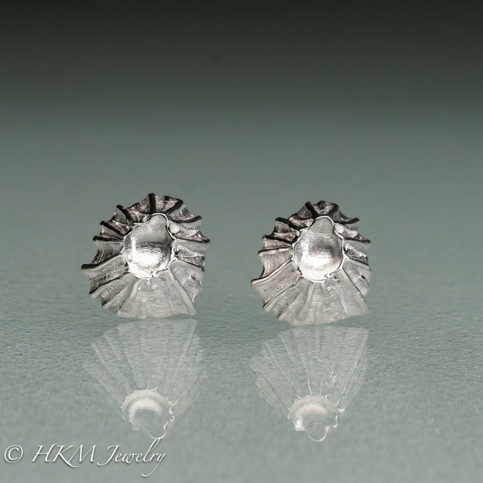 close up front view of cast silver fossil barnacle stud earrings in polished sterling silver by hkm jewelry