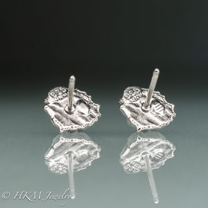 back view of hallmark 925 and makers mark HKM stamps cast silver fossil barnacle stud earrings in polished sterling silver by hkm jewelry