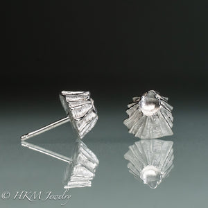 side and front view of cast silver fossil barnacle stud earrings in polished sterling silver by hkm jewelry