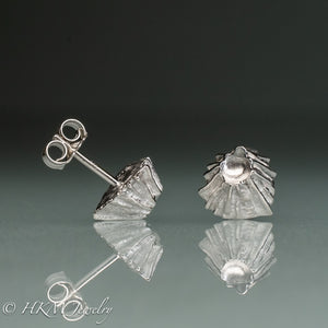side and top view of cast silver fossil barnacle stud earrings in polished sterling silver by hkm jewelry