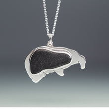 Load image into Gallery viewer, Silver pendant with a black sea glass on a gray background
