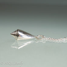 Load image into Gallery viewer, side view of florida cone snail necklace in polished silver finish by hkm jewelry
