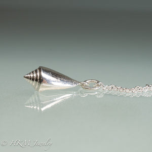 side view of florida cone snail necklace in polished silver finish by hkm jewelry
