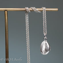 Load image into Gallery viewer, The Cowrie shell necklace is made from the molding and casting of a real found cowrie seashell in recycled silver by hkm jewelry
