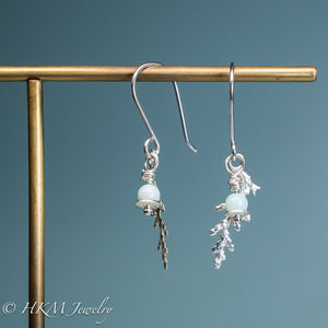 front and side view of cast cypress and amazonite cypress dangle earrings in polished sterling silver by hkm jewelry