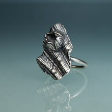 Load image into Gallery viewer, oxidized silver shell textured ring with barnacle on hand model with teal gradient background
