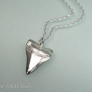 cast silver great white shark tooth necklaces in polished finish by hkm jewelry