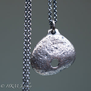 back of hag stone necklace cast in sterling silver by hkm jewelry in oxidized finish