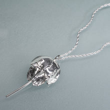 Load image into Gallery viewer, Silver horseshoe crab pendant on a chain against a light gray background
